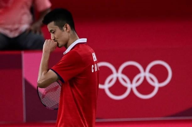 China's Chen Long celebrates after beating Taiwan's Chou Tien-chen in their men's singles badminton quarter final match during the Tokyo 2020 Olympic...