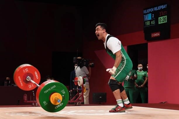 Turkmenistan's Rejepbay Rejepov competes in the men's 81kg weightlifting competition during the Tokyo 2020 Olympic Games at the Tokyo International...