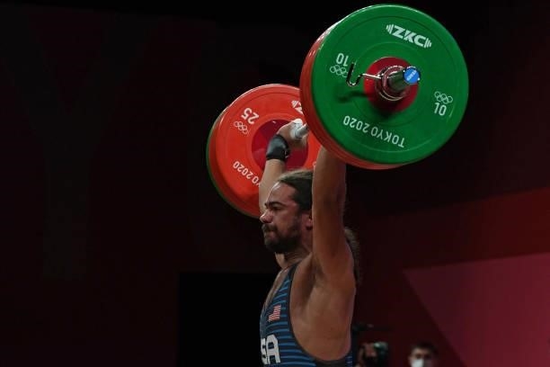 S Harrison James Maurus competes in the men's 81kg weightlifting competition during the Tokyo 2020 Olympic Games at the Tokyo International Forum in...