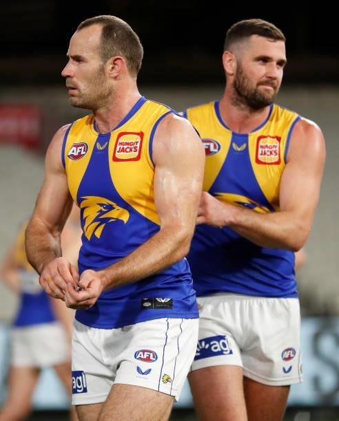 Shannon Hurn and Jack Darling of the Eagles look dejected after a loss during the 2021 AFL Round 20 match between the Collingwood Magpies and the...