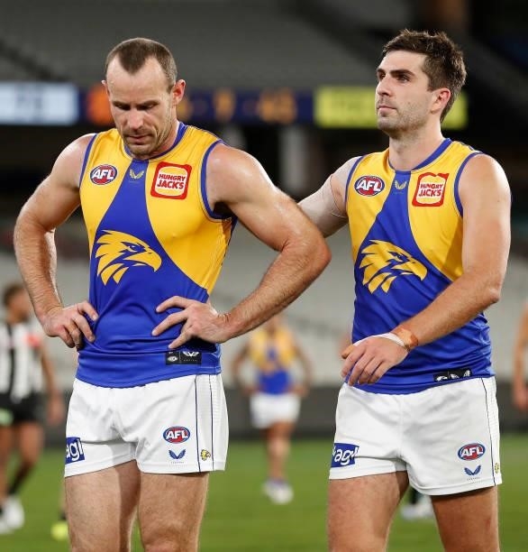 Shannon Hurn and Andrew Gaff of the Eagles look dejected after a loss during the 2021 AFL Round 20 match between the Collingwood Magpies and the West...