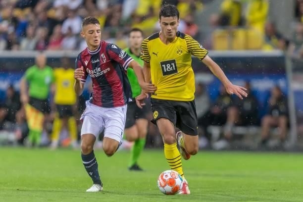 Kacper Urbanski of FC Bologna and Giovanni Reyna of Borussia Dortmund battle for the ball during the Preseason Friendly Match between Borussia...