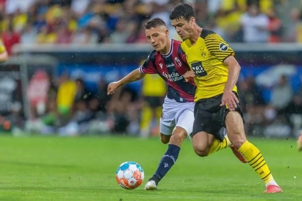 Kacper Urbanski of FC Bologna and Giovanni Reyna of Borussia Dortmund battle for the ball during the Preseason Friendly Match between Borussia...