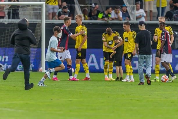 Marco Reus of Borussia Dortmund gives autographs after the Preseason Friendly Match between Borussia Dortmund and FC Bologna at CASHPOINT Arena on...