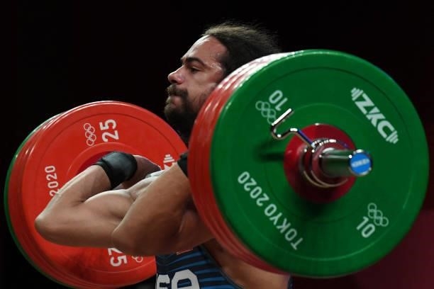 S Harrison James Maurus competes in the men's 81kg weightlifting competition during the Tokyo 2020 Olympic Games at the Tokyo International Forum in...