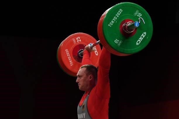 Germany's Nico Mueller competes in the men's 81kg weightlifting competition during the Tokyo 2020 Olympic Games at the Tokyo International Forum in...
