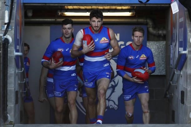 Marcus Bontempelli of the Bulldogs leads his team up the race during the 2021 AFL Round 20 match between the Western Bulldogs and the Adelaide Crows...