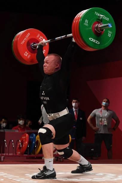 Latvia's Ritvars Suharevs competes in the men's 81kg weightlifting competition during the Tokyo 2020 Olympic Games at the Tokyo International Forum...