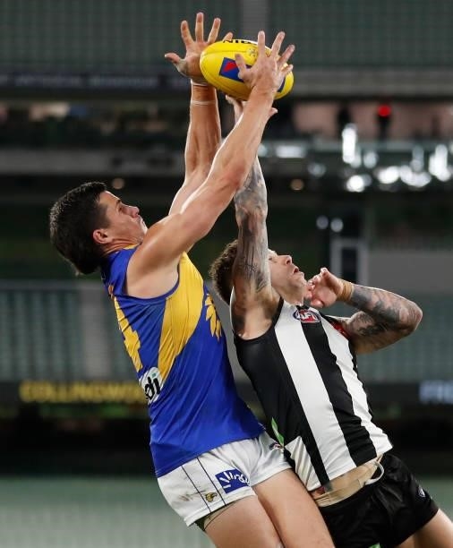Jamie Elliott of the Magpies and Liam Duggan of the Eagles compete for the ball during the 2021 AFL Round 20 match between the Collingwood Magpies...