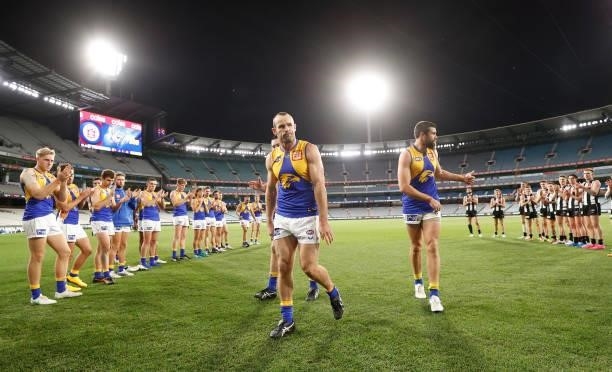 Shannon Hurn of the Eagles leaves the field after his 300th match during the 2021 AFL Round 20 match between the Collingwood Magpies and the West...