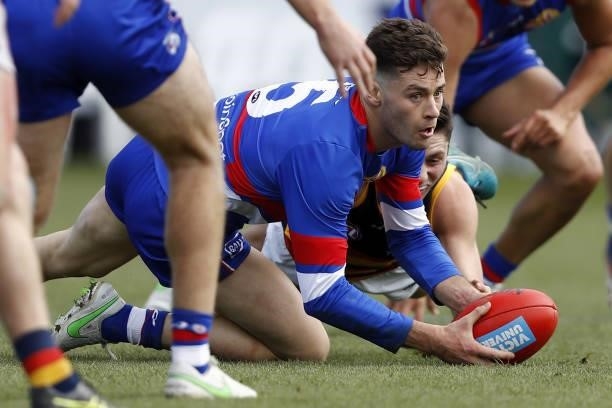 Josh Dunkley of the Bulldogs gains possession of the ball during the 2021 AFL Round 20 match between the Western Bulldogs and the Adelaide Crows at...