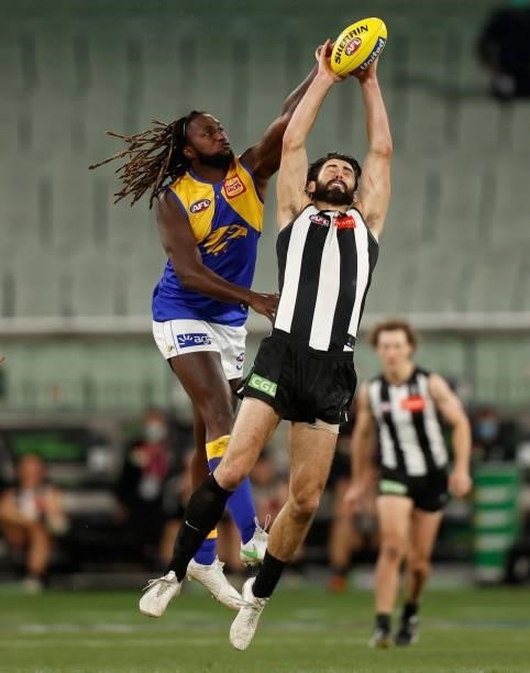 Nic Naitanui of the Eagles and Brodie Grundy of the Magpies compete in a ruck contest during the 2021 AFL Round 20 match between the Collingwood...