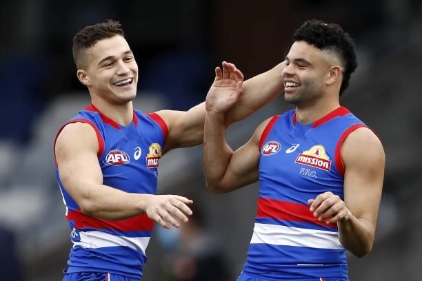 Jason Johannisen of the Bulldogs celebrates a goal with Riley Garcia of the Bulldogs during the 2021 AFL Round 20 match between the Western Bulldogs...