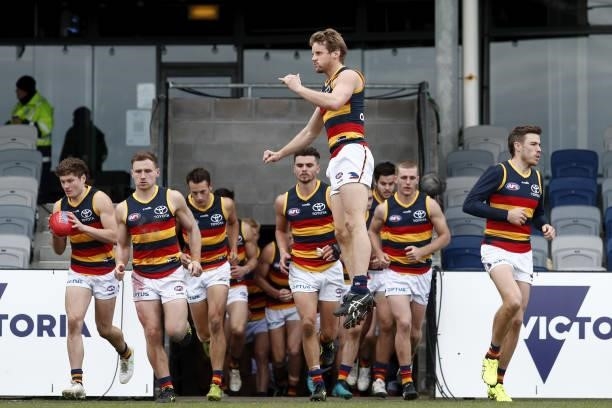 The Adelaide Crows run on to the field during the 2021 AFL Round 20 match between the Western Bulldogs and the Adelaide Crows at Mars Stadium on July...