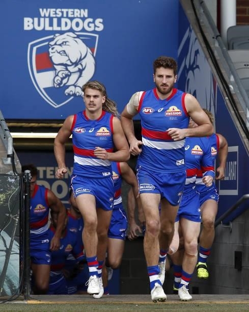 Marcus Bontempelli of the Bulldogs and Bailey Smith of the Bulldogs run on to the field during the 2021 AFL Round 20 match between the Western...
