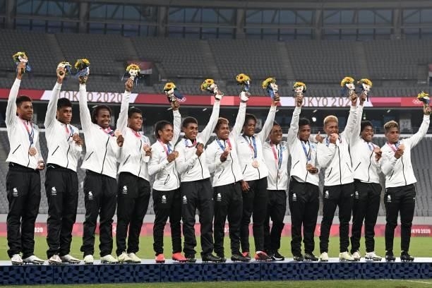 Bronze medallists Fiji stand on the podium for the victory ceremony after the women's final rugby sevens match during the Tokyo 2020 Olympic Games at...
