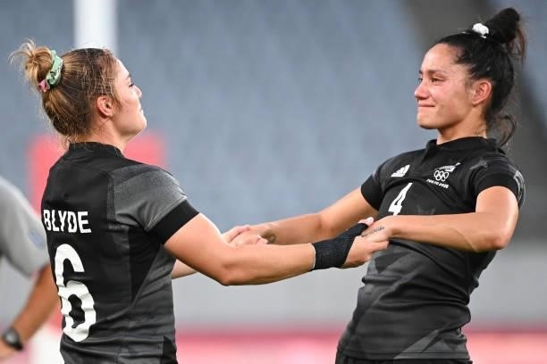 New Zealand's Michaela Blyde and Shiray Kaka react after winning the women's final rugby sevens match between New Zealand and France during the Tokyo...