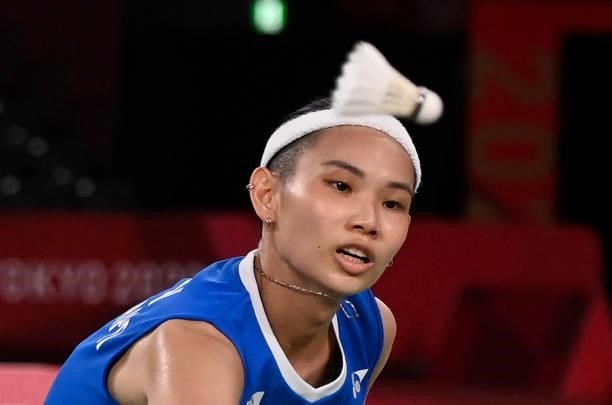 Taiwan's Tai Tzu-ying looks on during a rally with India's P. V. Sindhu in their women's singles badminton semi-final match during the Tokyo 2020...