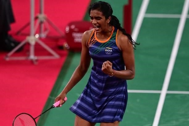 India's P. V. Sindhu reacts after a point with Taiwan's Tai Tzu-ying in their women's singles badminton semi-final match during the Tokyo 2020...