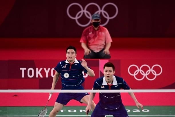 Malaysia's Soh Wooi Yik and Malaysia's Aaron Chia prepare for a shot during a rally in their men's doubles badminton bronze medal match against...