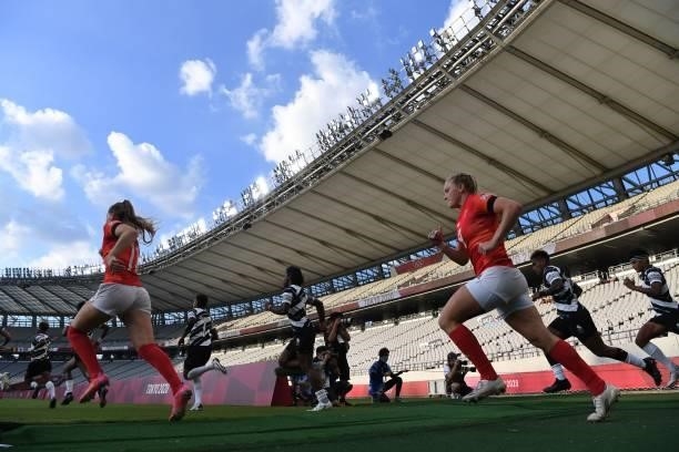 Players take the field for the women's bronze medal rugby sevens match between Fiji and Britain during the Tokyo 2020 Olympic Games at the Tokyo...