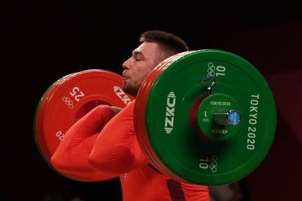 Poland's Bartlomiej Stejan Adamus competes in the men's 96kg weightlifting competition during the Tokyo 2020 Olympic Games at the Tokyo International...