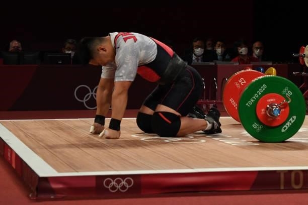 Japan's Toshiki Yamamoto competes in the men's 96kg weightlifting competition during the Tokyo 2020 Olympic Games at the Tokyo International Forum in...
