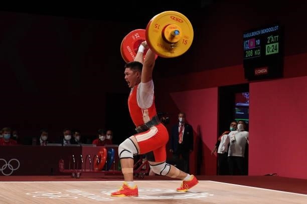 Kyrgyzstan's Bekdoolot Rasulbekov competes in the men's 96kg weightlifting competition during the Tokyo 2020 Olympic Games at the Tokyo International...