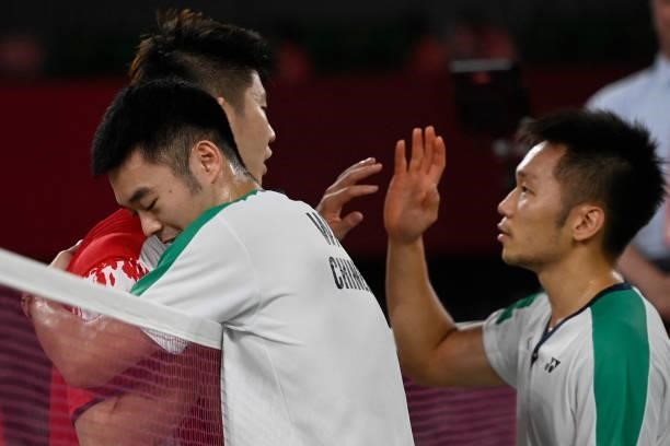 Taiwan's Lee Yang and Taiwan's Wang Chi-lin celebrate winning their men's doubles badminton final match against China's Li Junhui and as China's Liu...