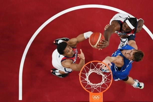 S Houston Jerami Grant and Keldon Johnson and Czech Republic's Jan Vesely in the men's preliminary round group A basketball match between USA and...