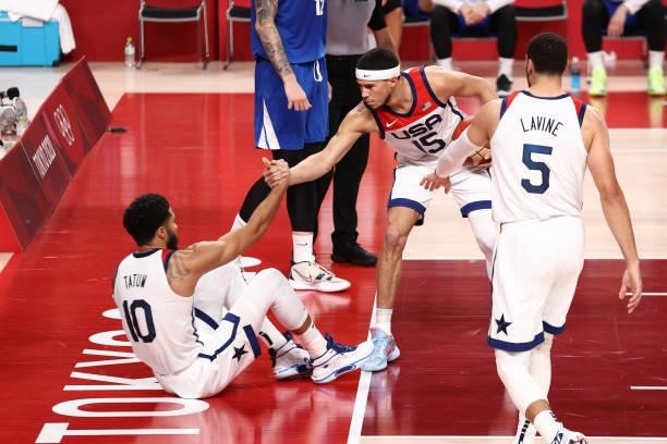 Devin Booker helps up Jayson Tatum of the USA Men's National Team during the game against the Czech Republic Men's National Team during the 2020...
