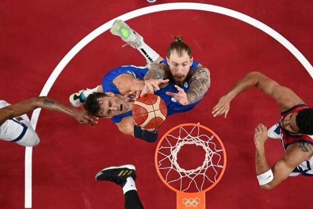 Czech Republic's Jan Vesely and Patrik Auda jump for a rebound in the men's preliminary round group A basketball match between USA and Czech Republic...
