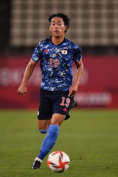 Daichi Hayashi of Japan dribbles the ball during the Men's Quarter Final match on day eight of the Tokyo 2020 Olympic Games at Kashima Stadium on...