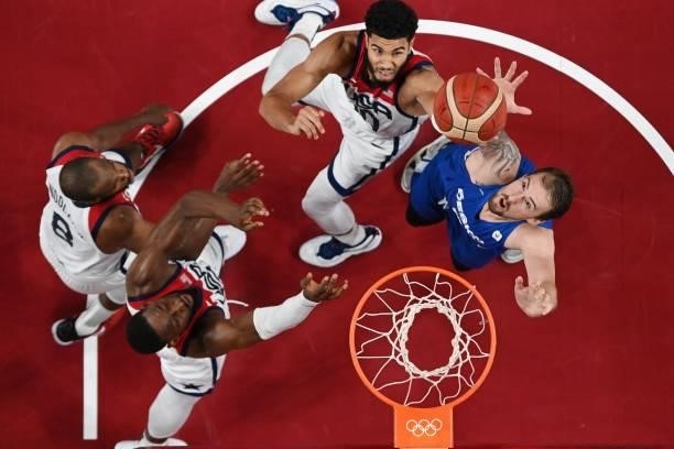 S Jayson Tatum and Czech Republic's Ondrej Balvin jump for a rebound in the men's preliminary round group A basketball match between USA and Czech...
