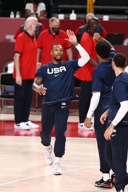 Damian Lillard of the USA Men's National Team hi-fives his teammates before the game against the Czech Republic Men's National Team during the 2020...