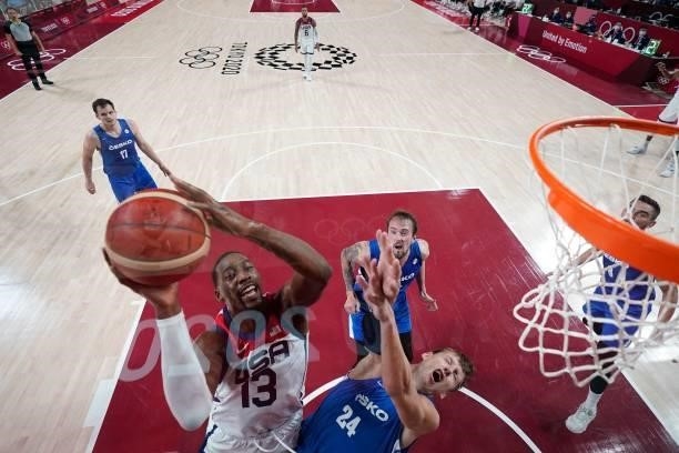 S Edrice Femi Adebayo goes to the basket past Czech Republic's Jan Vesely in the men's preliminary round group A basketball match between USA and...