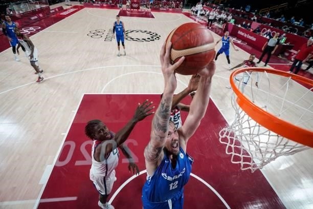 Czech Republic's Ondrej Balvin goes for a dunk past USA's Jrue Holiday in the men's preliminary round group A basketball match between USA and Czech...