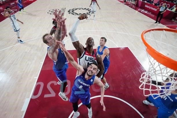 S Edrice Femi Adebayo fights for a rebound with Czech Republic's Ondrej Balvin and Tomas Satoransky in the men's preliminary round group A basketball...