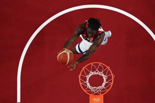 S Jrue Holiday goes to the basket in the men's preliminary round group A basketball match between USA and Czech Republic during the Tokyo 2020...