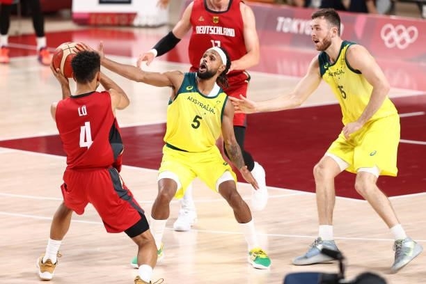Patty Mills of the Australia Men's National Team plays defense during the game against the Germany Men's National Team during the 2020 Tokyo Olympics...
