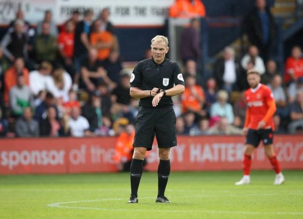 Referee Graham Scott during the pre-season friendly match between Luton Town and Brighton & Hove Albion at Kenilworth Road on July 31, 2021 in Luton,...
