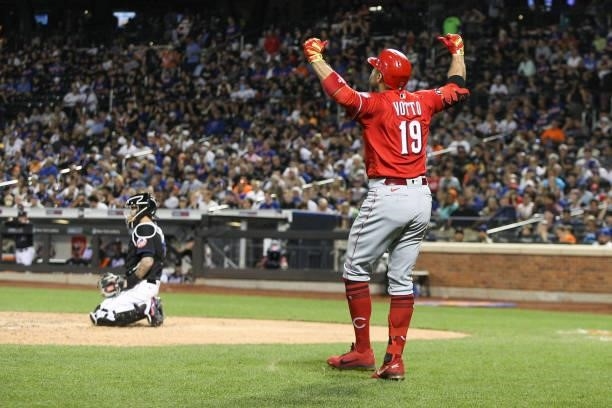 Joey Votto of the Cincinnati Reds celebrates after hitting a home run in his seventh consecutive game during the game between the Cincinnati Reds and...