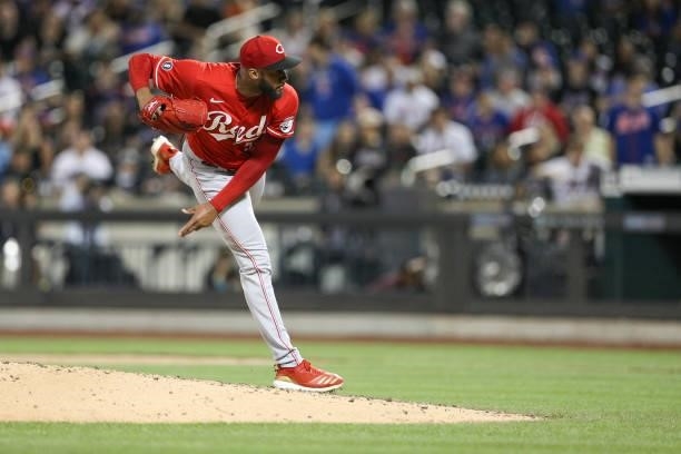 Amir Garrett of the Cincinnati Reds pitches during the game between the Cincinnati Reds and the New York Mets at Citi Field on Friday, July 30, 2021...