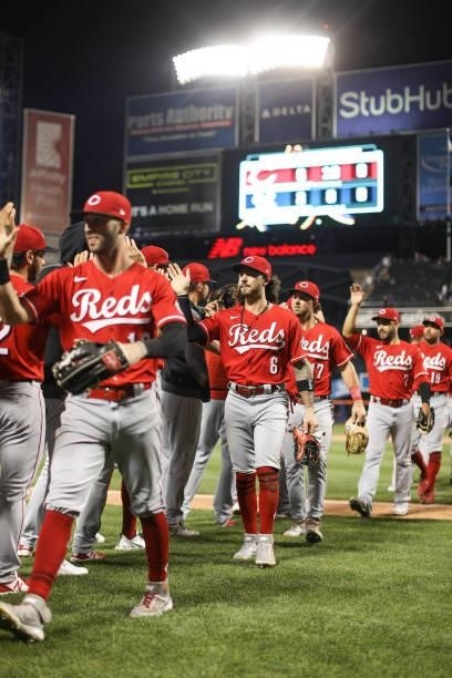 The Cincinnati Reds celebrate after winning the game between the Cincinnati Reds and the New York Mets at Citi Field on Friday, July 30, 2021 in New...
