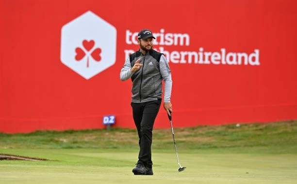 Jordan Smith of England waves to the crowd on the 18th green after completing their rounds during Day Three of The ISPS HANDA World Invitational at...