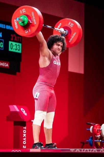 Fares Ibrahim E H Elbakh of Quatar compete in the Men's 96kg Group B weightlifting competition on day eight of the Tokyo 2020 Olympic Games at Tokyo...