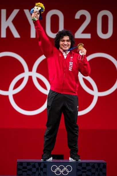 Fares Ibrahim E H Elbakh of Quatar cheers at the award ceremony in the Men's 96kg Group B weightlifting competition on day eight of the Tokyo 2020...