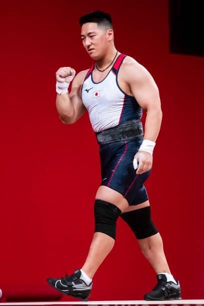 Toshiki Yamamoto of Japan celebrates in the Men's 96kg Group B weightlifting competition on day eight of the Tokyo 2020 Olympic Games at Tokyo...