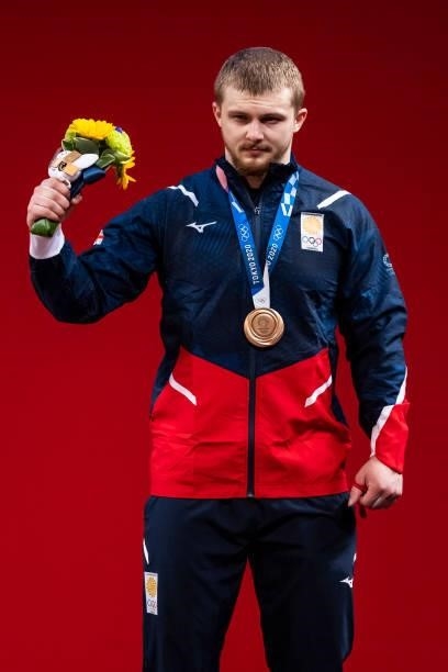 Anton Pliesnoi of Georgia cheers at the award ceremony in the Men's 96kg Group B weightlifting competition on day eight of the Tokyo 2020 Olympic...