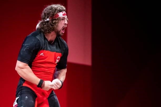Boady Robertsantavy of Canada celebrates in the Men's 96kg Group B weightlifting competition on day eight of the Tokyo 2020 Olympic Games at Tokyo...